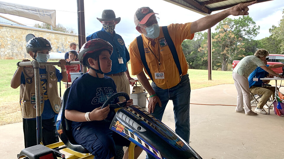 kids ride push carts at royal ambassador campout and missions mania in texas