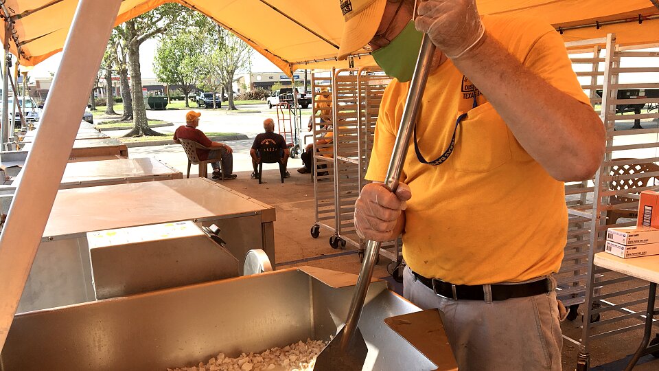 tbm disaster relief volunteers prepare food after hurricane delta